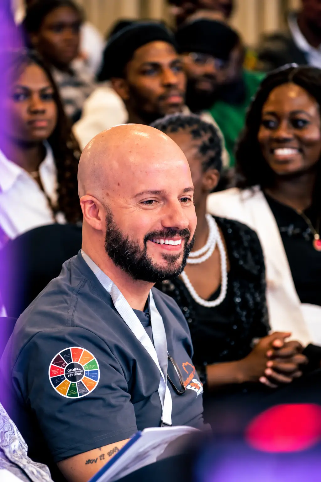 Calvin Smith smiling in the audience at the Global Entrepreneur Festival
