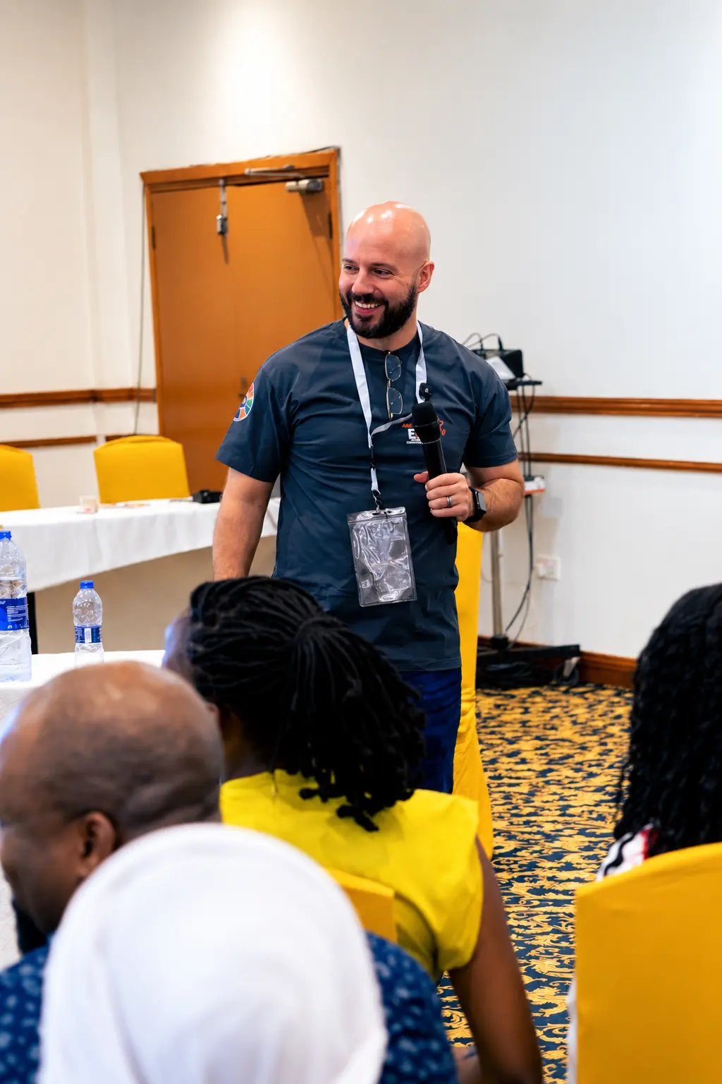 Calvin Smith speaking to an audience of entrepreneurs at an indoor conference